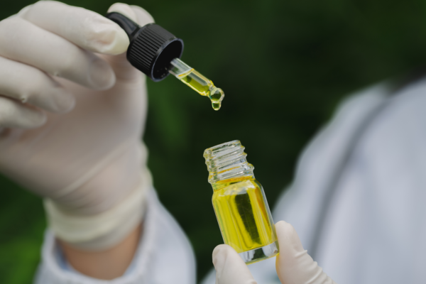 doctor holding bottle of medical cannabis